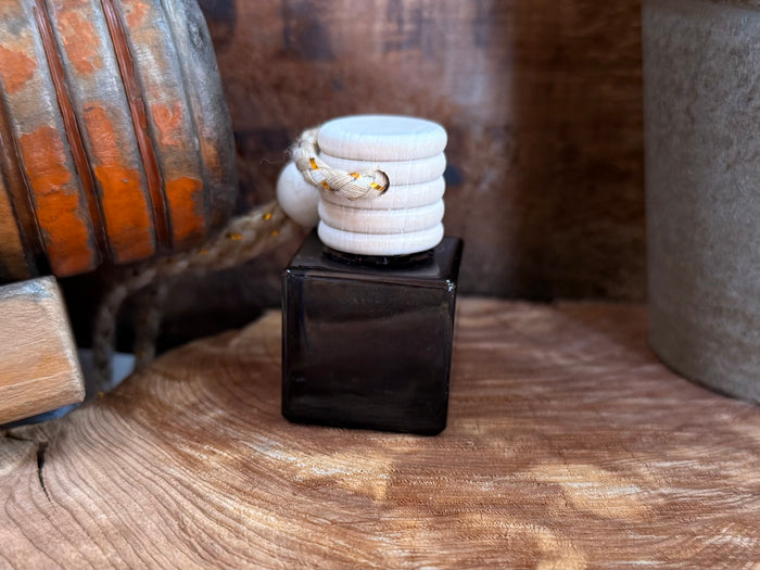 Car diffuser black cube base with white stacked fabric-like top