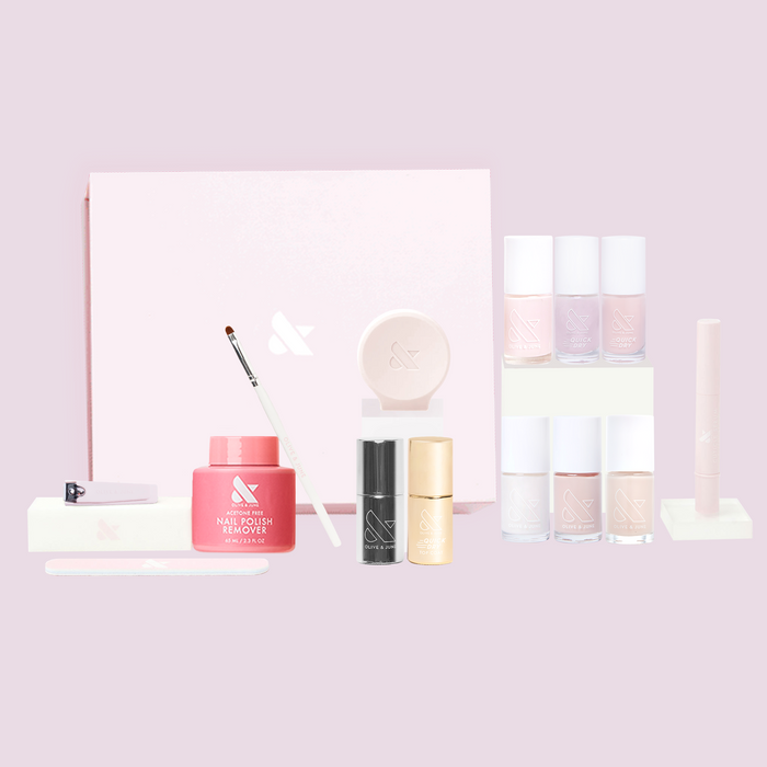 Bare Nail System with sheer neutral and subtle shimmer polishes, remover, and tools for quick dry at-home mani.